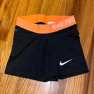 Black Nike Pros with Orange Waistband